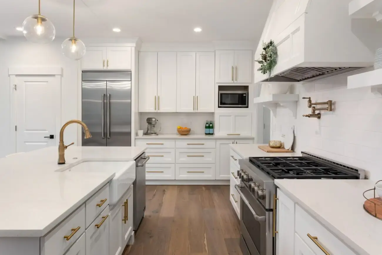 Custom white kitchen cabinetry with soft-close drawers, glass cabinet doors, and modern hardware in Calgary home